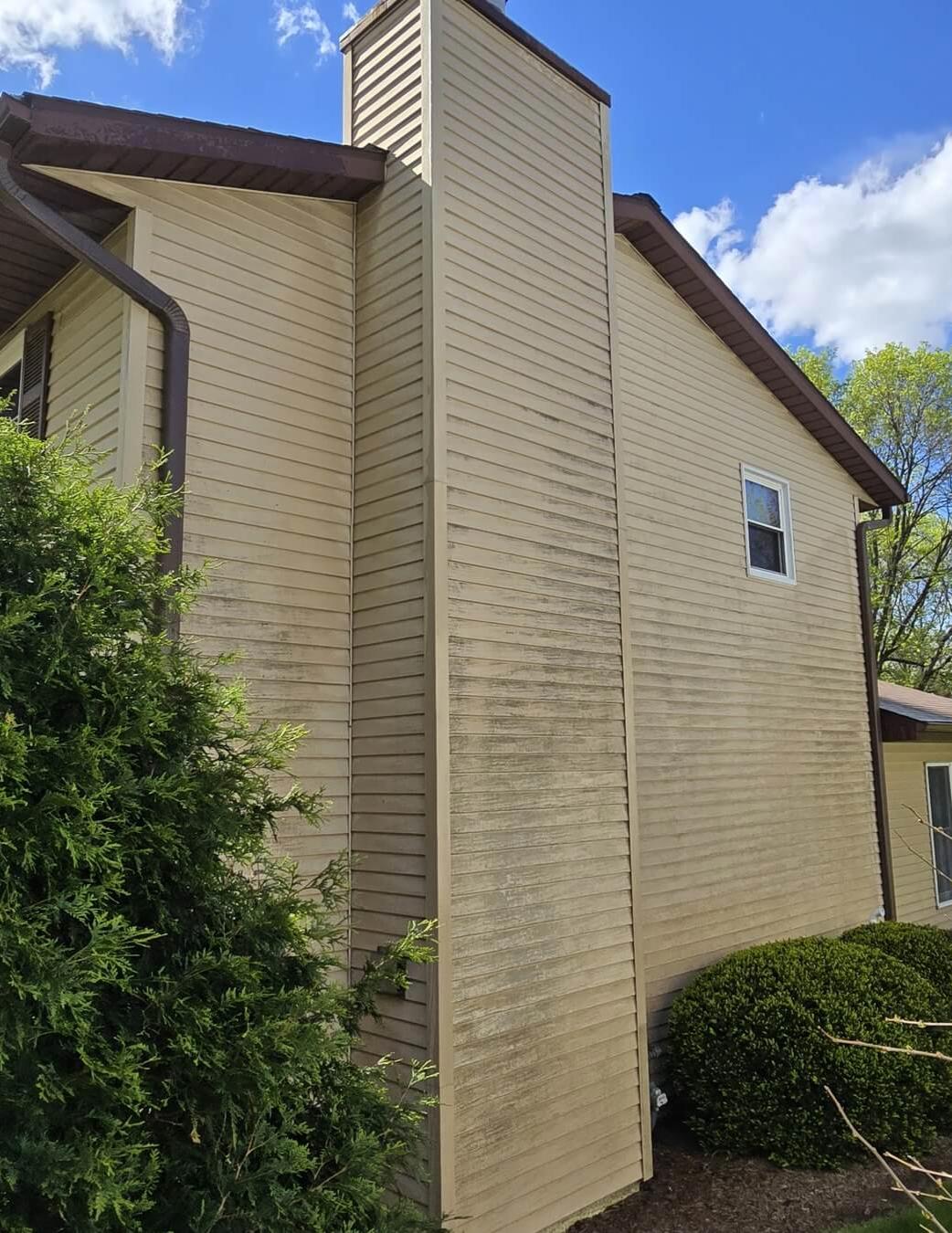 Home's weathered siding, dirty from years of neglect