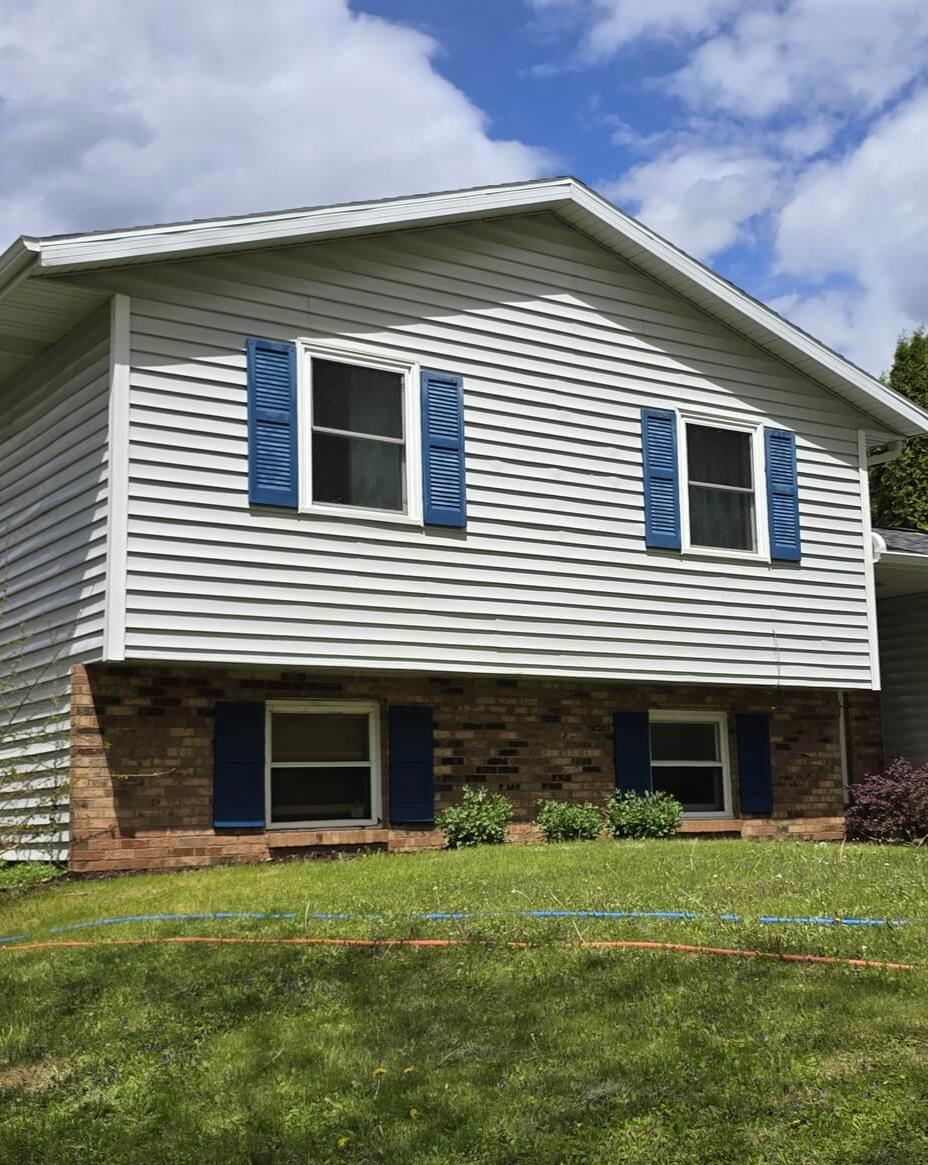 A House in Portage, Wisconsin received a soft wash for the siding, exterior window clean, a roof wash, and a driveway cleaning.