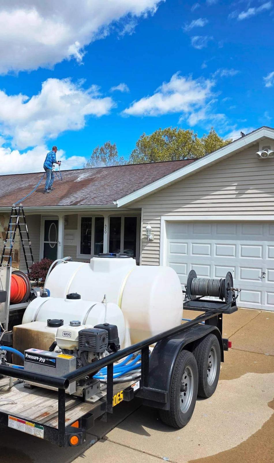 A house in Sun Prairie getting siding and the roof soft washed.
