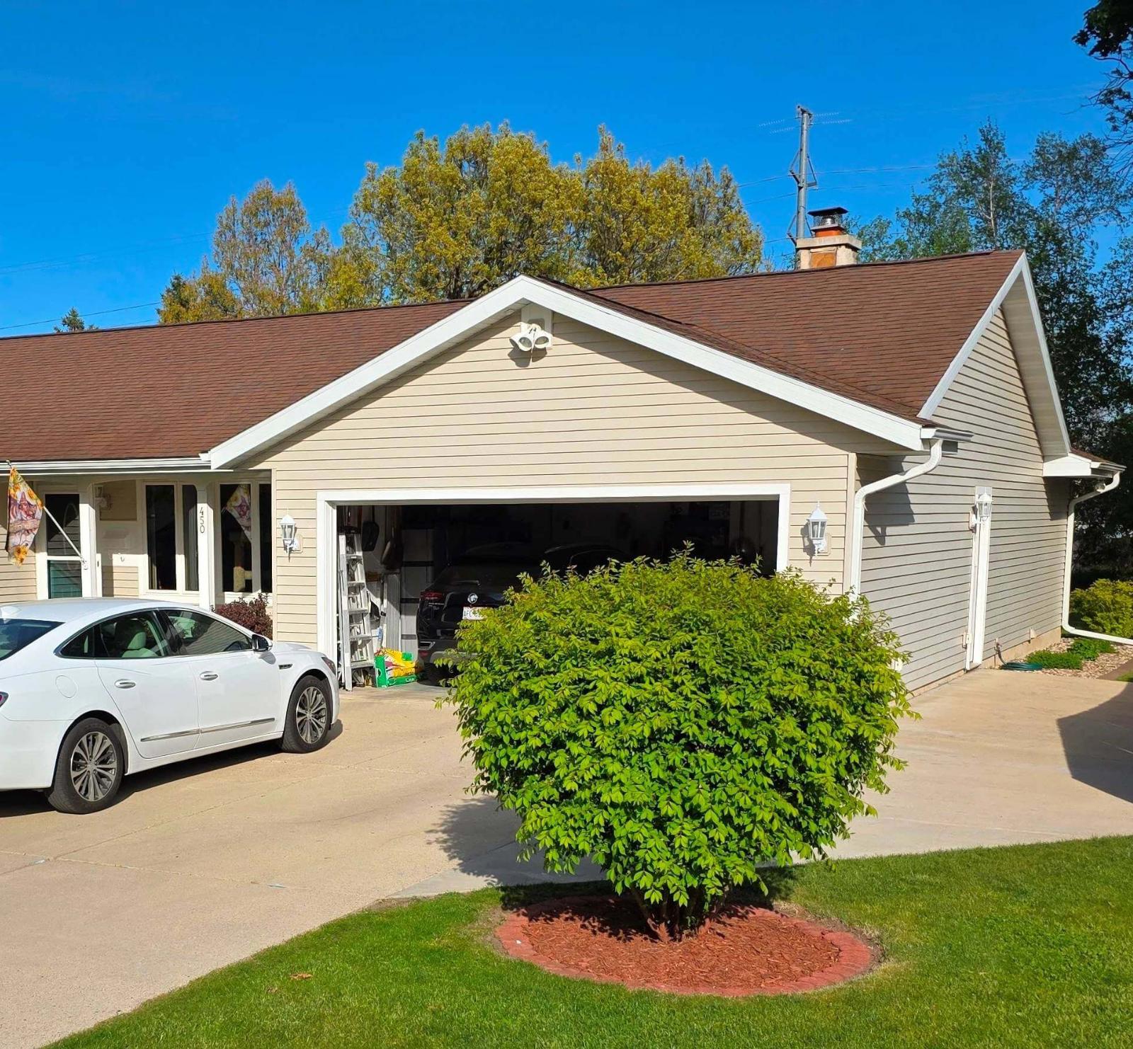 Home in Verona received soft washing of the roof and siding, as well as pressure washing of the driveway.